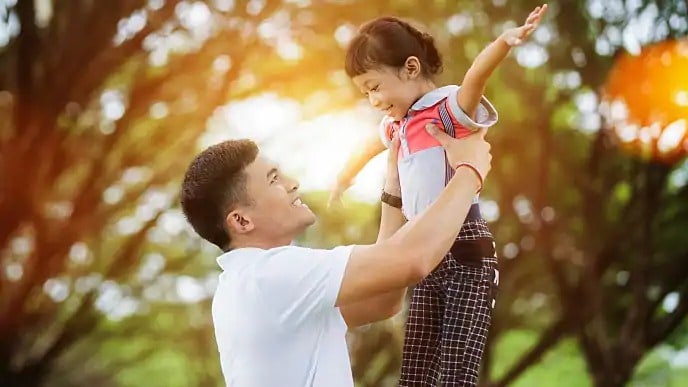 father playing with daughter