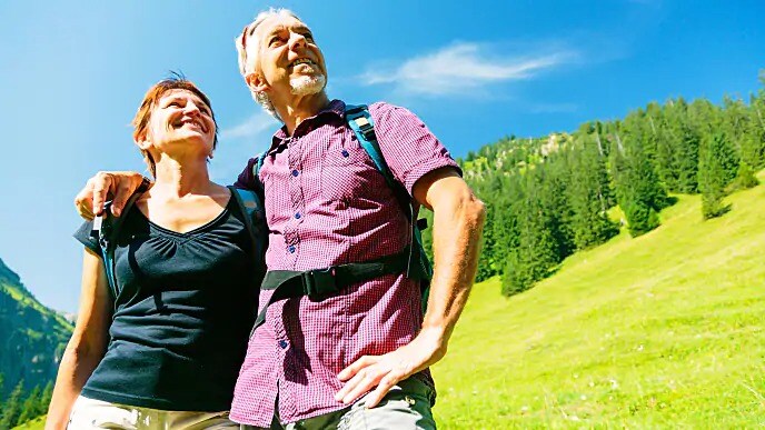 older couple smiling outside