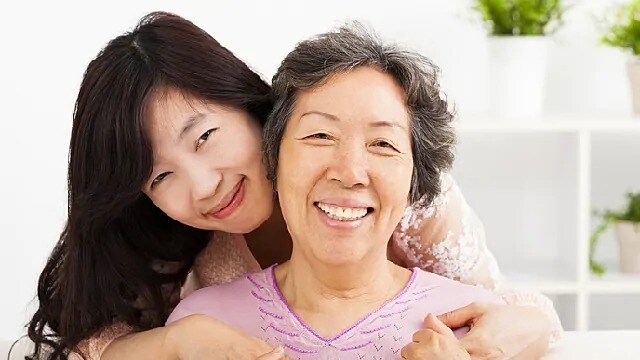 woman with dentures smiling