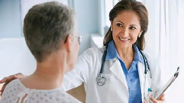 dentist discussing oral cancer surgery with patient