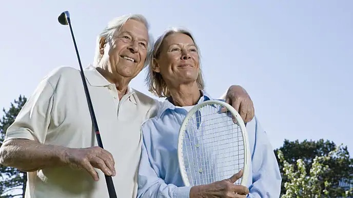 older couple smiling outside