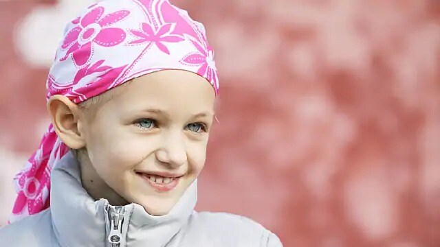 child smiling outside