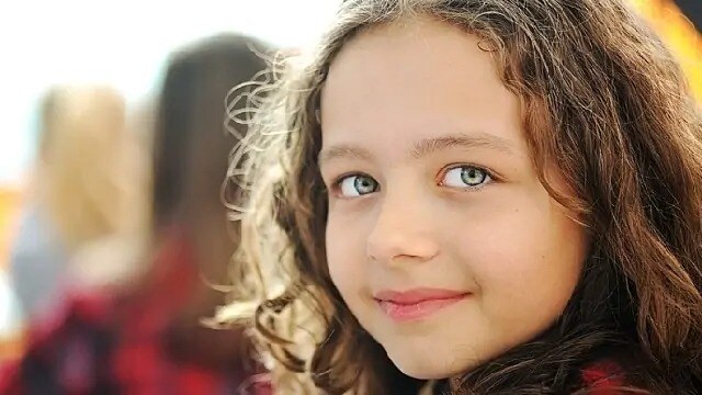 girl smiling after dental treatment