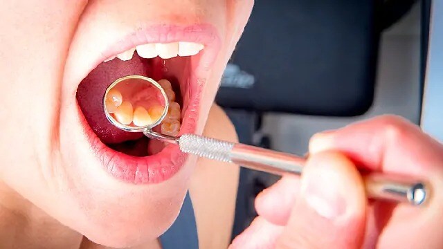 dentist performing dental exam