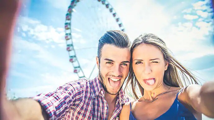 couple sticking their tongue out