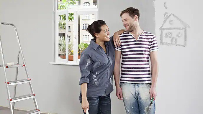 couple painting house