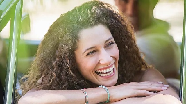 Smiling woman without braces on her teeth
