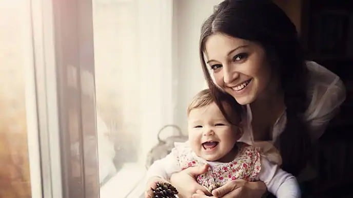 Infant with new teeth smiling