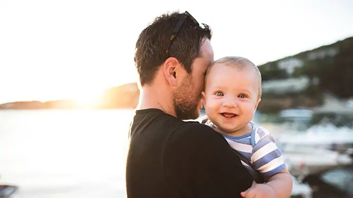 infant with no teeth smiling