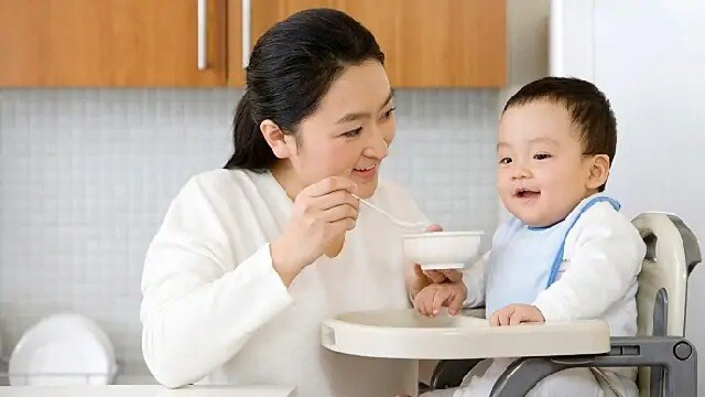 mom feeding infant