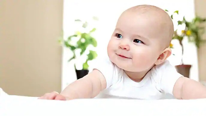 infant smiling at parent