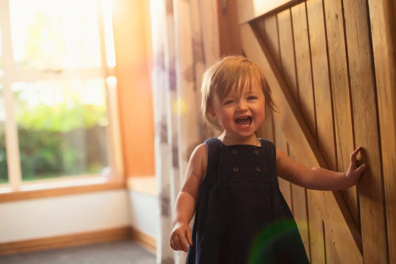 Smiling toddler standing