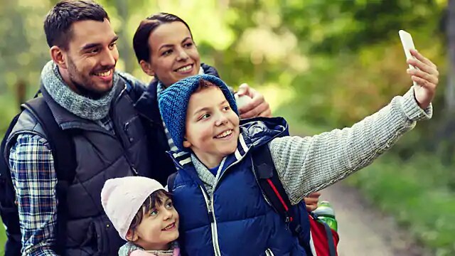 family smiling after parent underwent CEREC procedure