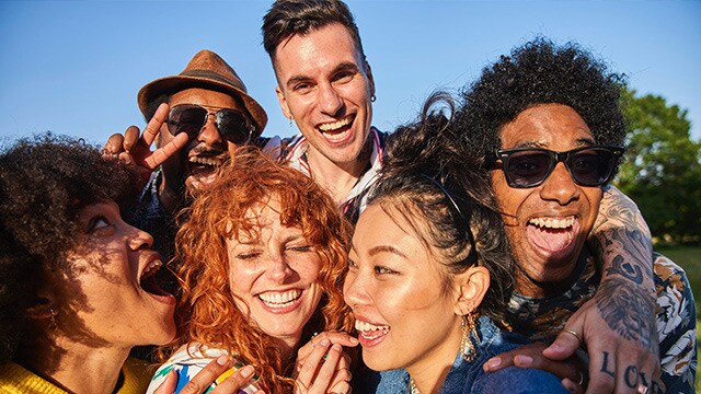 group of friends posing for a selfie outdoor