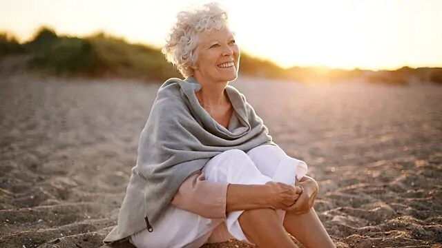 woman smiling after treatment for brittle teeth