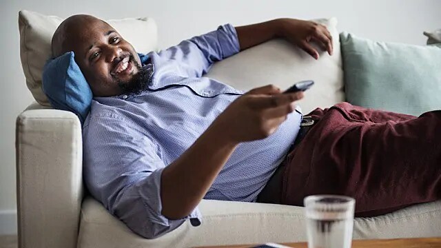 man drinking water after tooth extraction