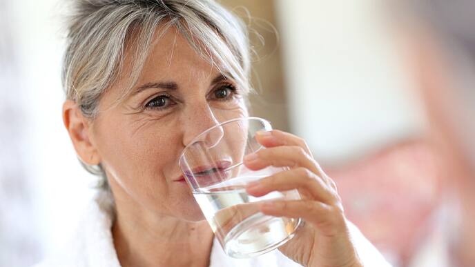 Woman Using Baking Soda Mouthrinse