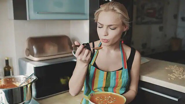 woman eating soup after dental treatment