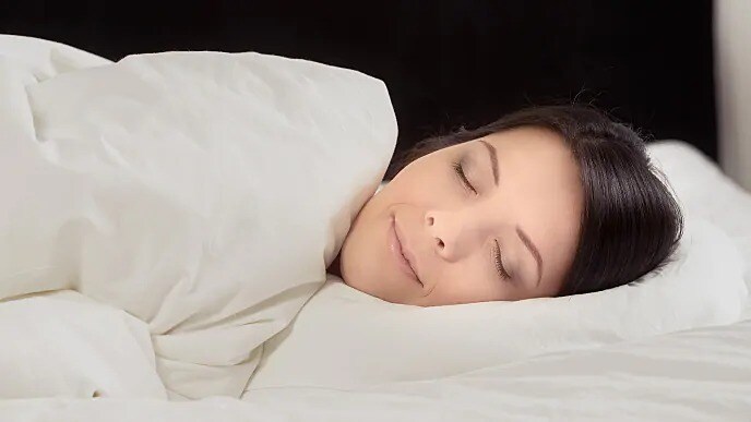 Woman Sleeping with Mouth Guard In