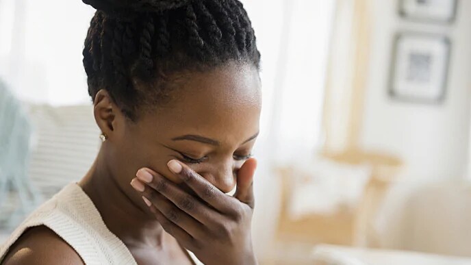 woman smiling after having jagged teeth fixed