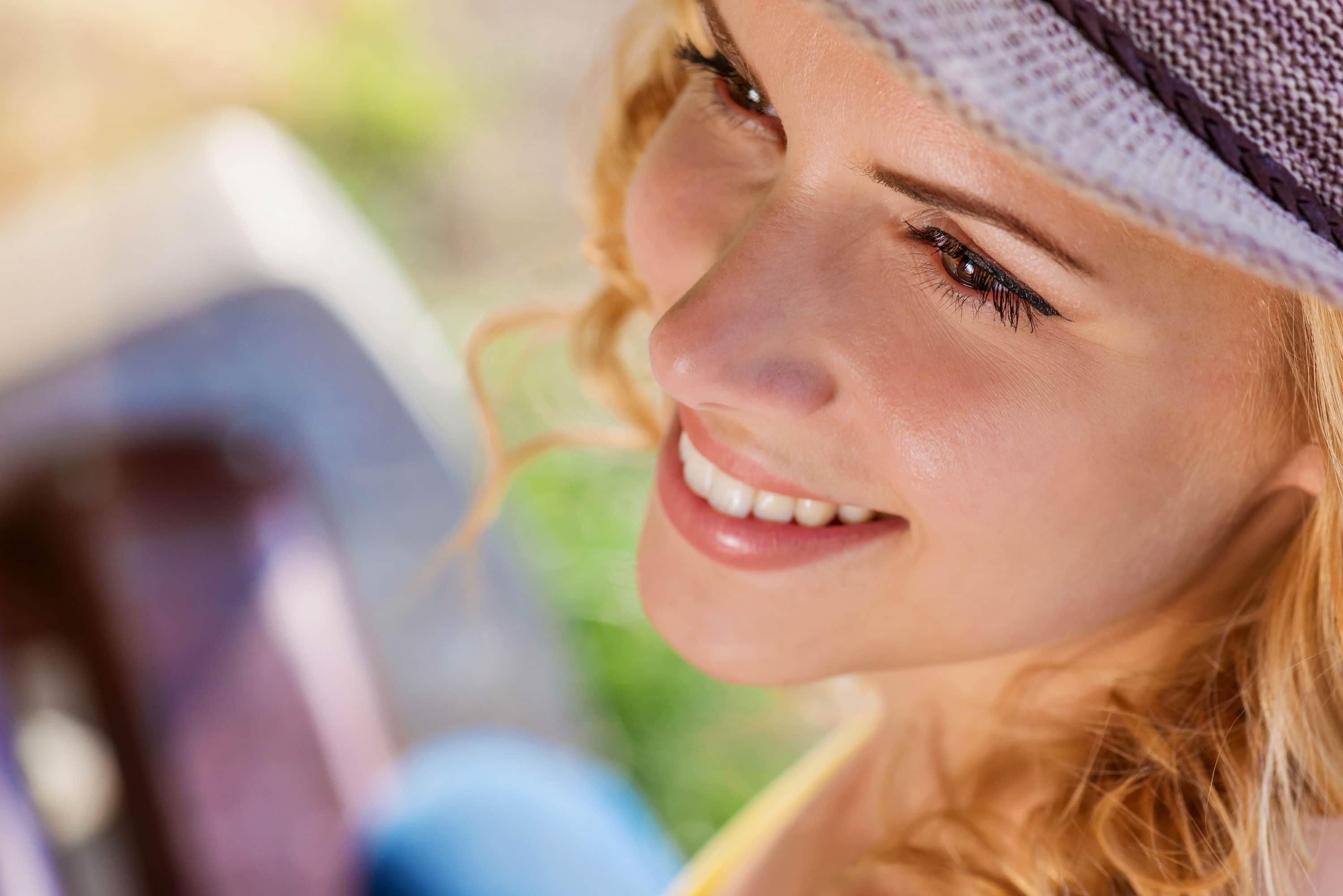 woman smiling after cleaning retainer