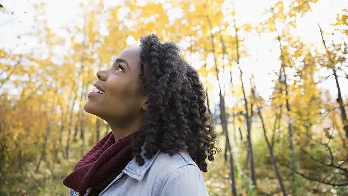 woman smiling after having a torus removed from roof of mouth