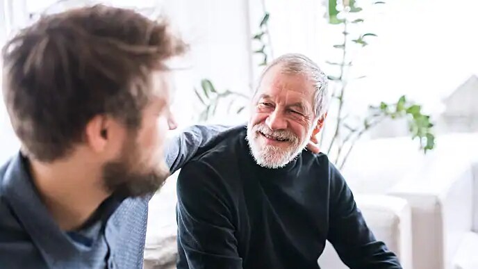 father and son discussing gum health