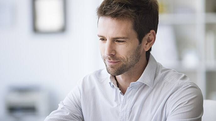 man smiling after visiting the dentist for excessive drooling