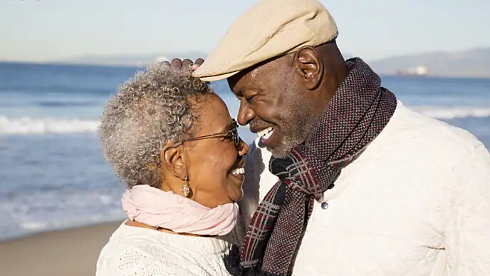 older couple smiling after tmj arthritis treatment