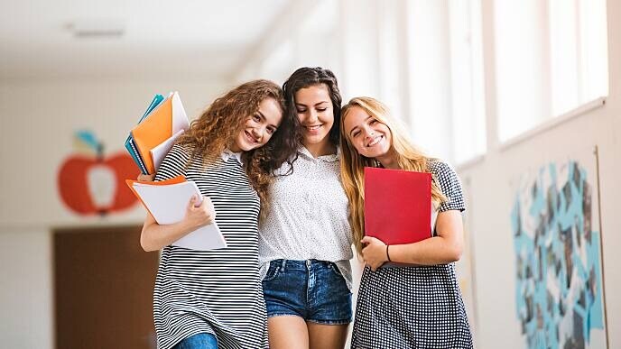 women smiling at dental school