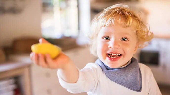 child with baby teeth smiling