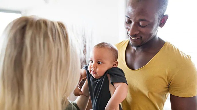 family holding baby