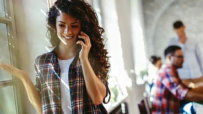 woman speaking with dentist about pre-visit cleaning