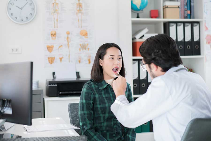Doctor examining the patient's oral cavity in his dental office Doctor examining the patient's oral cavity in his dental office