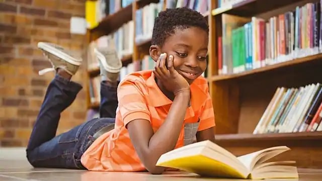 child reading about dentistry child reading about dentistry