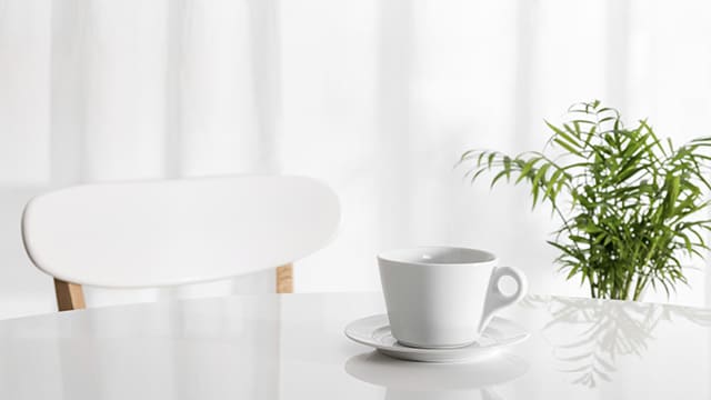 White cup on kitchen table