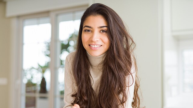 1452708734 woman smiling after dental surgery