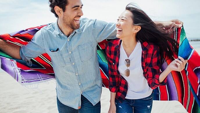 couple smiling after UV teeth whitening procedure