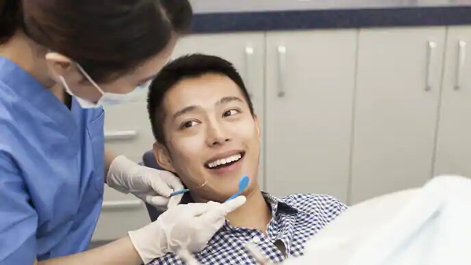man smiling after having dental grill removed
