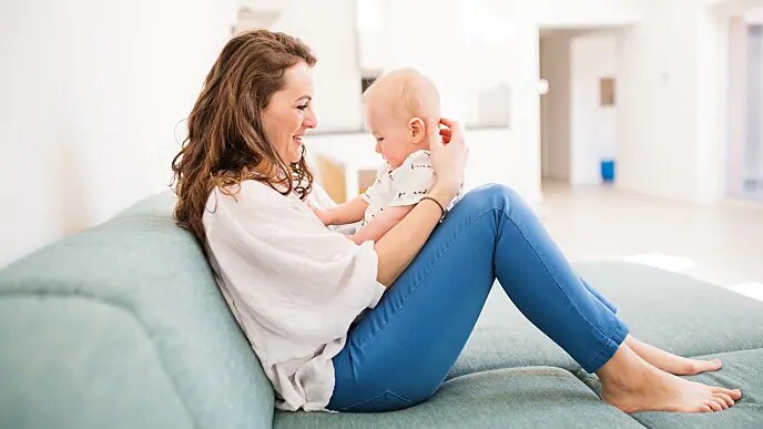 mother holding infant