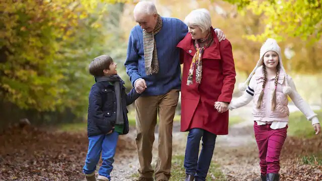 grandparents walking with grandson