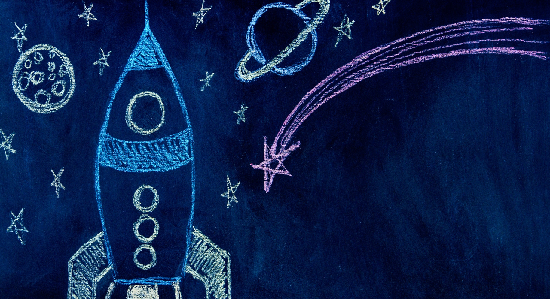 chalk drawing of spaceship and stars