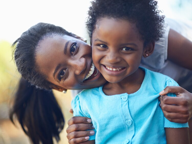 smiling woman and child with white teeth