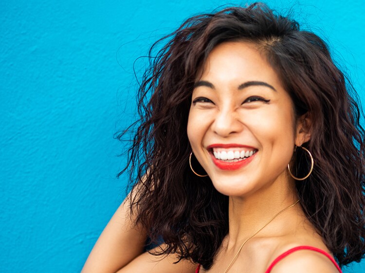 woman smiling after using colgate