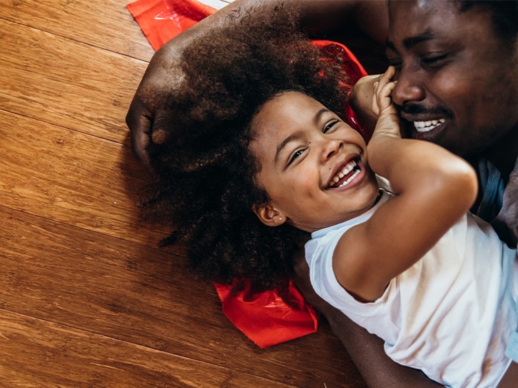 smiling child playing with parent