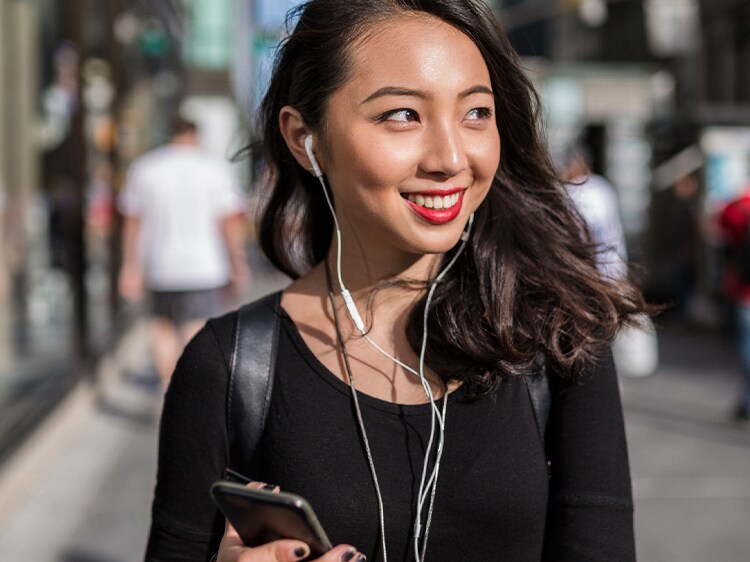 smiling woman wearing headphones