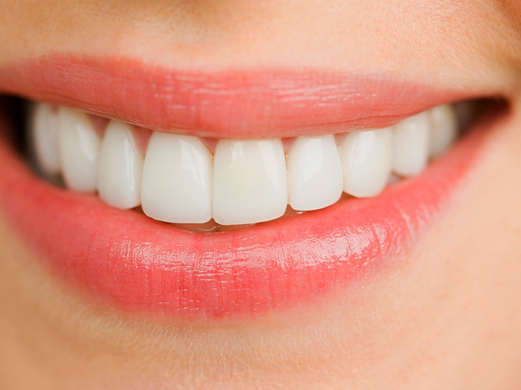 close up of smiling woman with white teeth