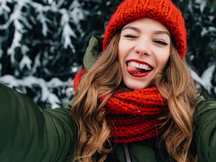 woman outside in the winter taking a selfie