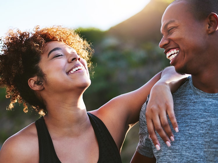 couple smiling while looking at each other