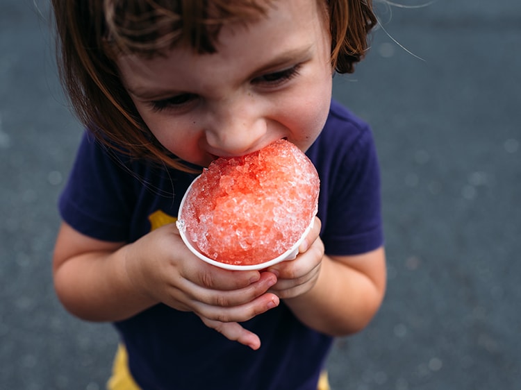 toddler eating snow cone
